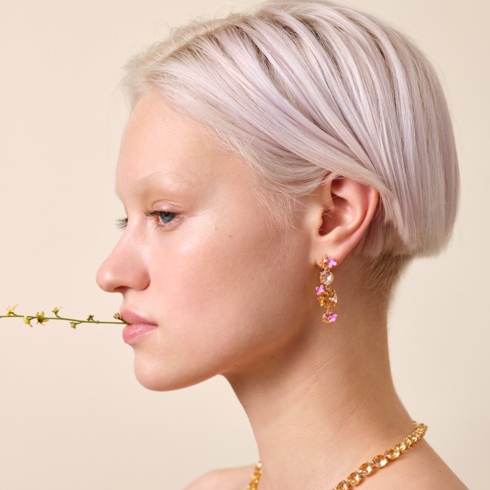 Apricot pink diamantine 4 stone and flower dangling post earrings