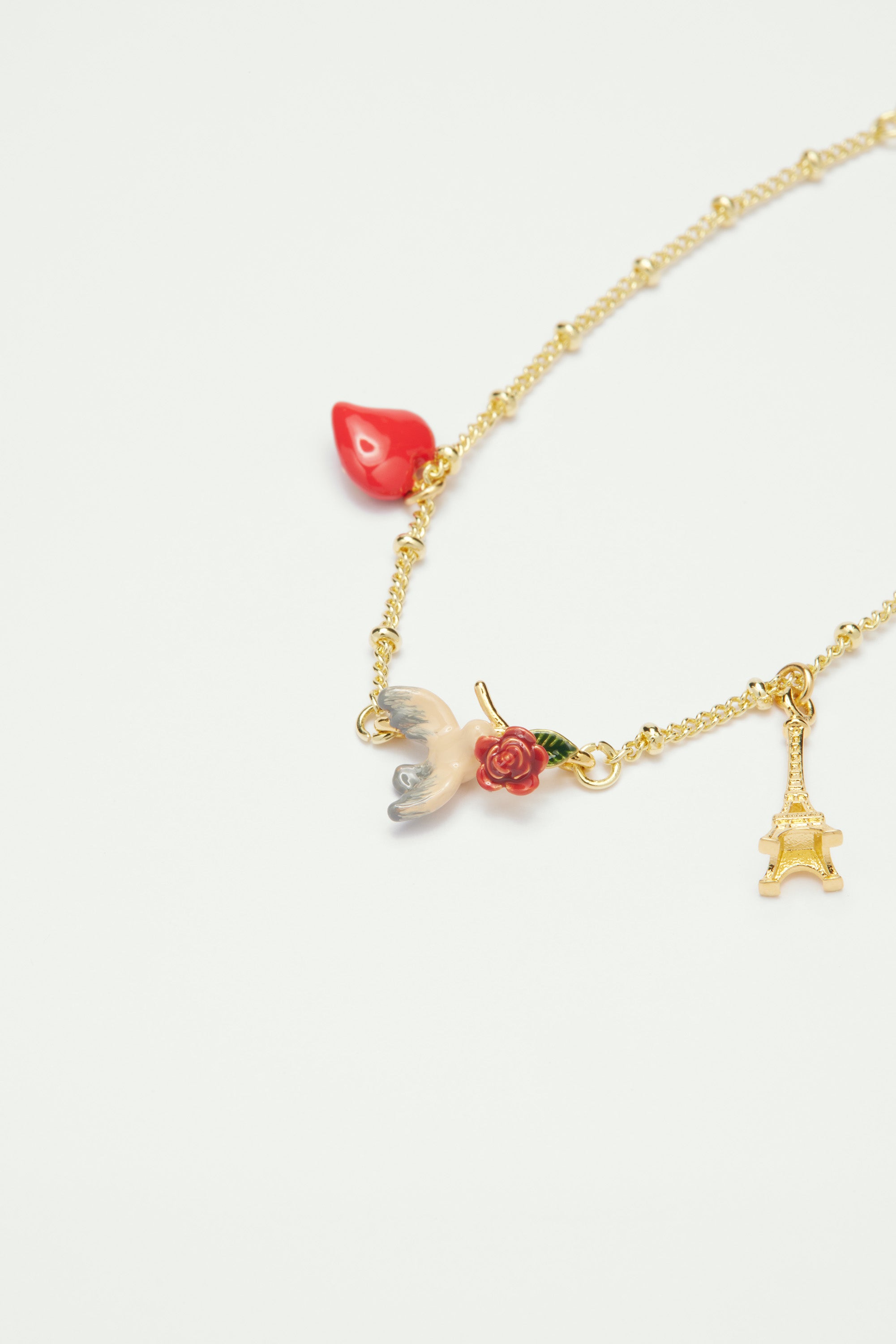 Eiffel tower, heart, sparrow and rose fine bracelet