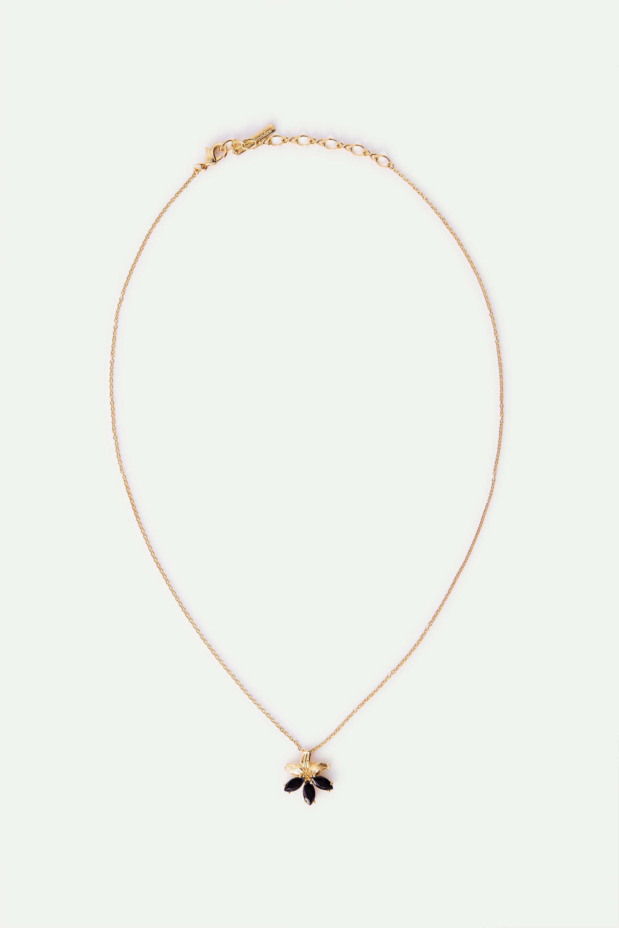 Collar colgante dorado lirio y piedras negras