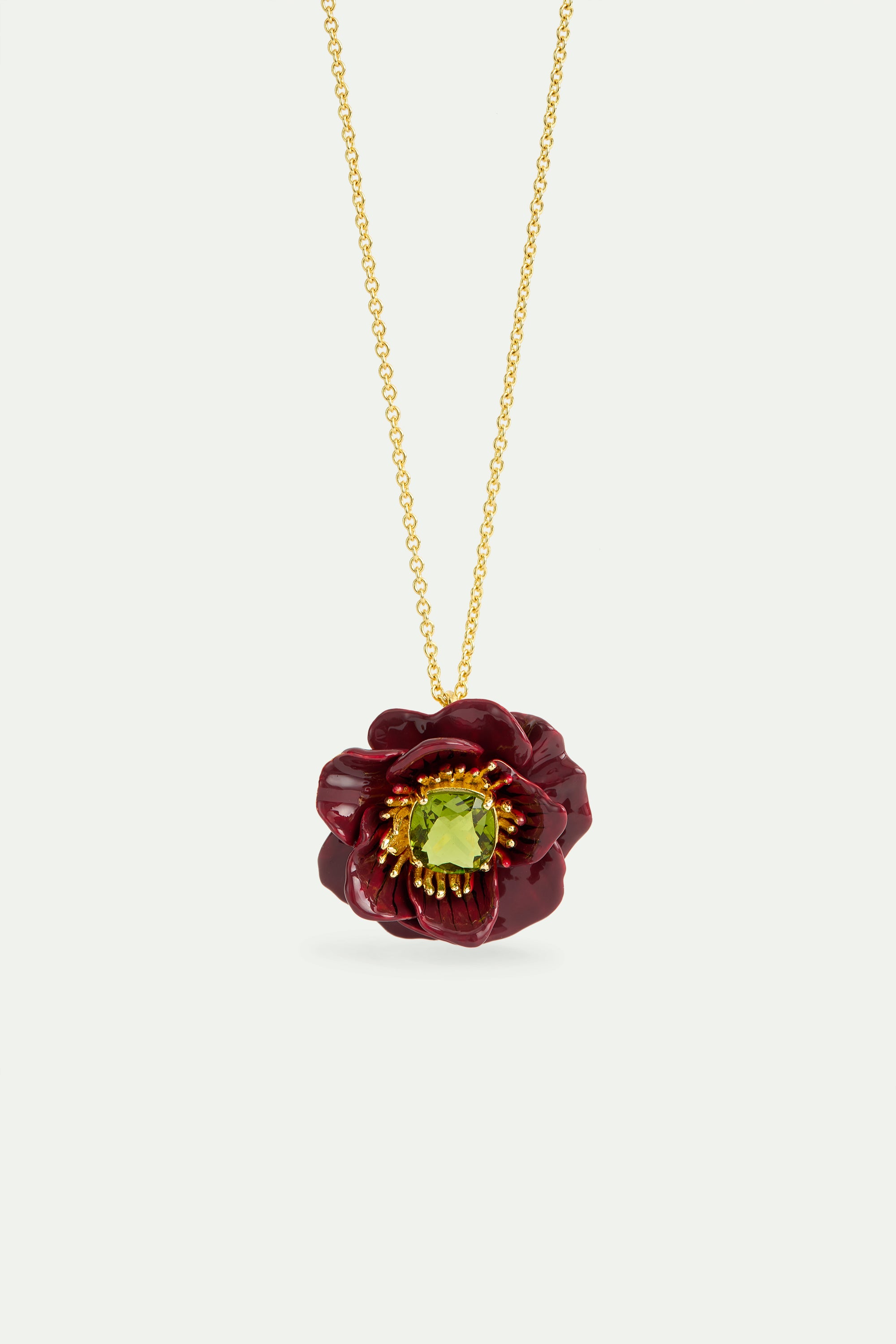 Pendant necklace with burgundy anemone flower and green faceted stone