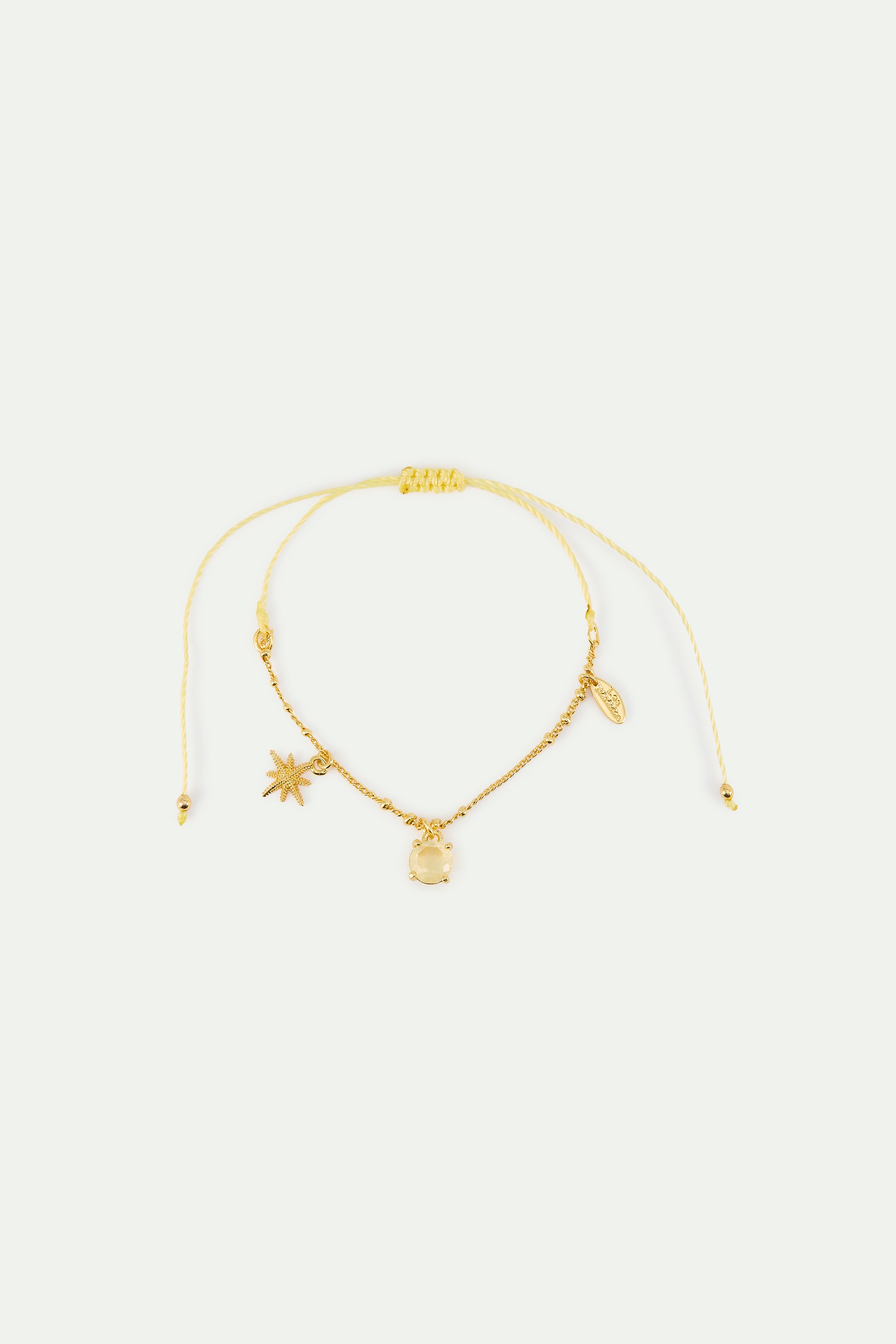 Pulsera fina estrella dorada y piedra amarilla