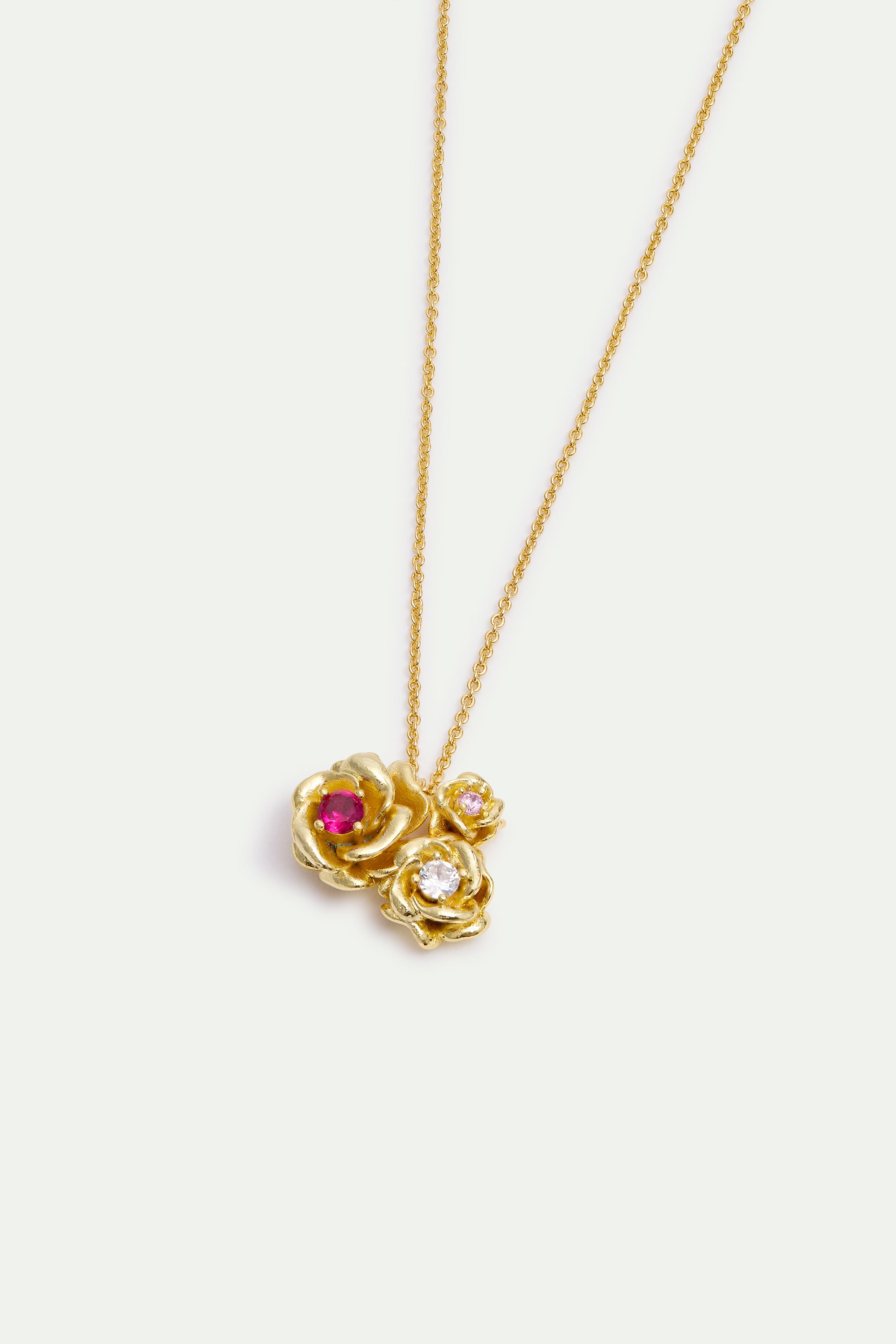 Pendant necklace with gold Mona Lisa roses and round stones