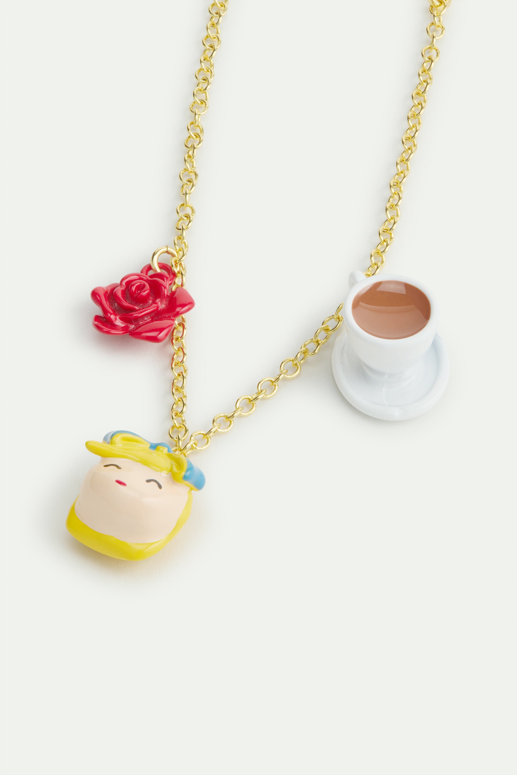 Fine bracelet featuring Alice in Wonderland, red rose and tea cup
