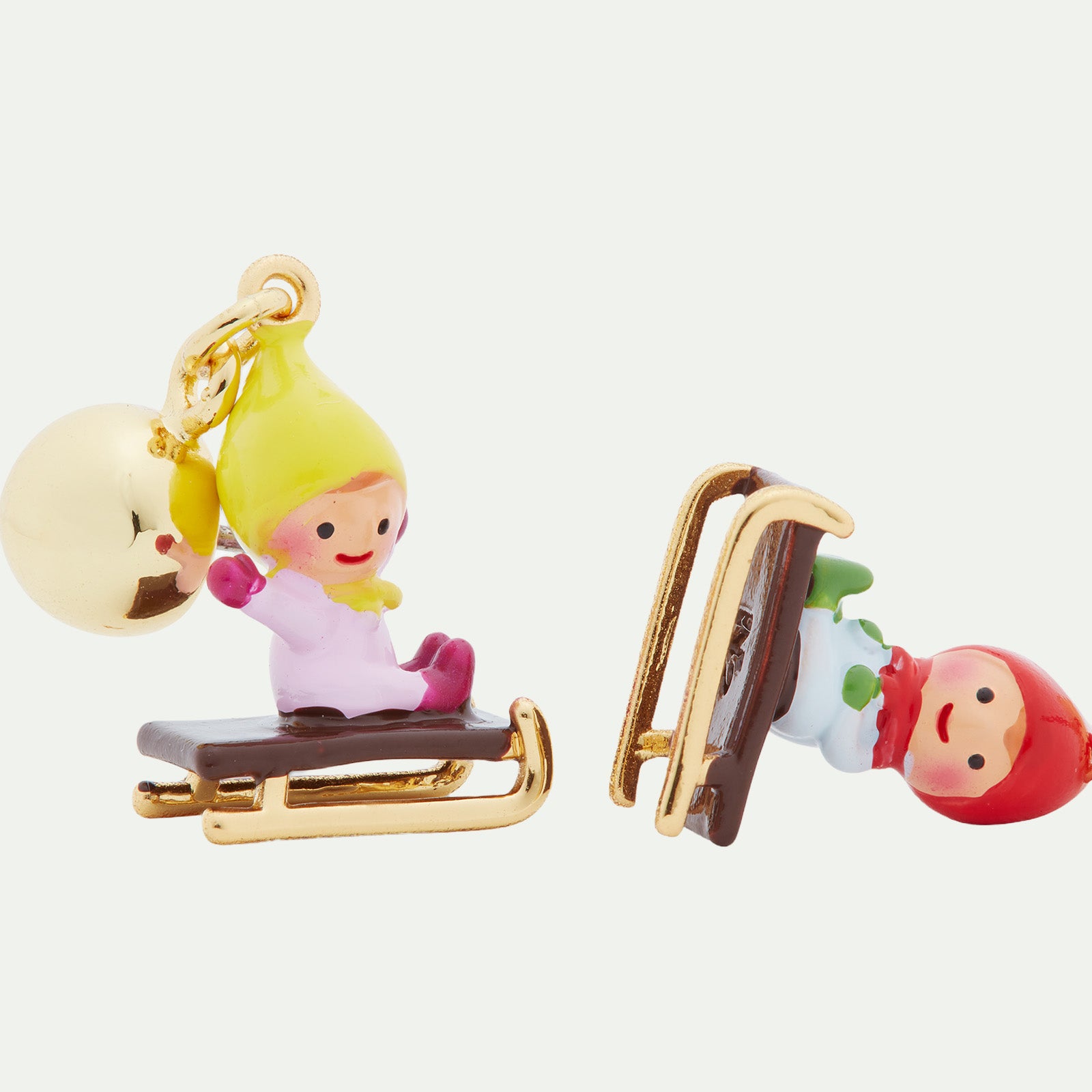 Sledging young garden gnome clip-on earrings