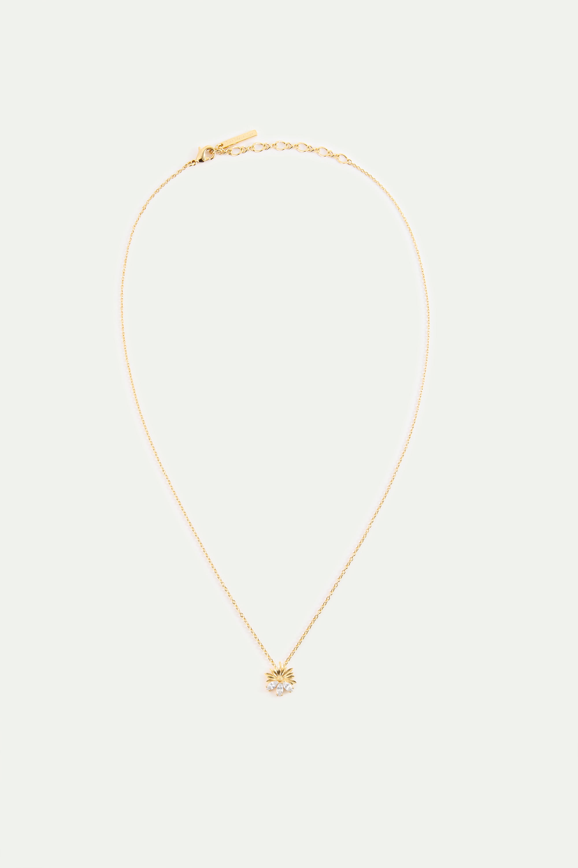 Collier pendentif doré marguerite et pierres blanches