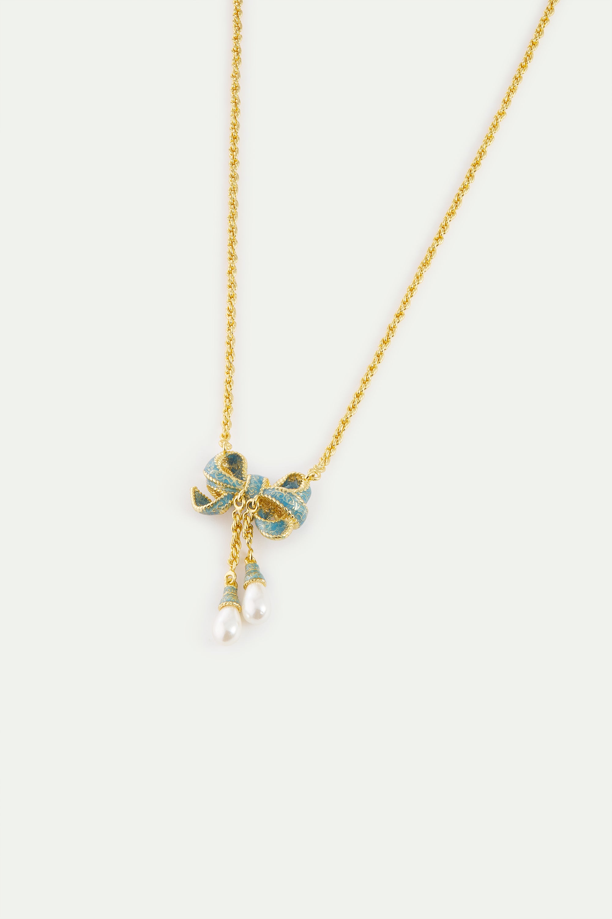Collier pendentif nœud bleu et perles de culture