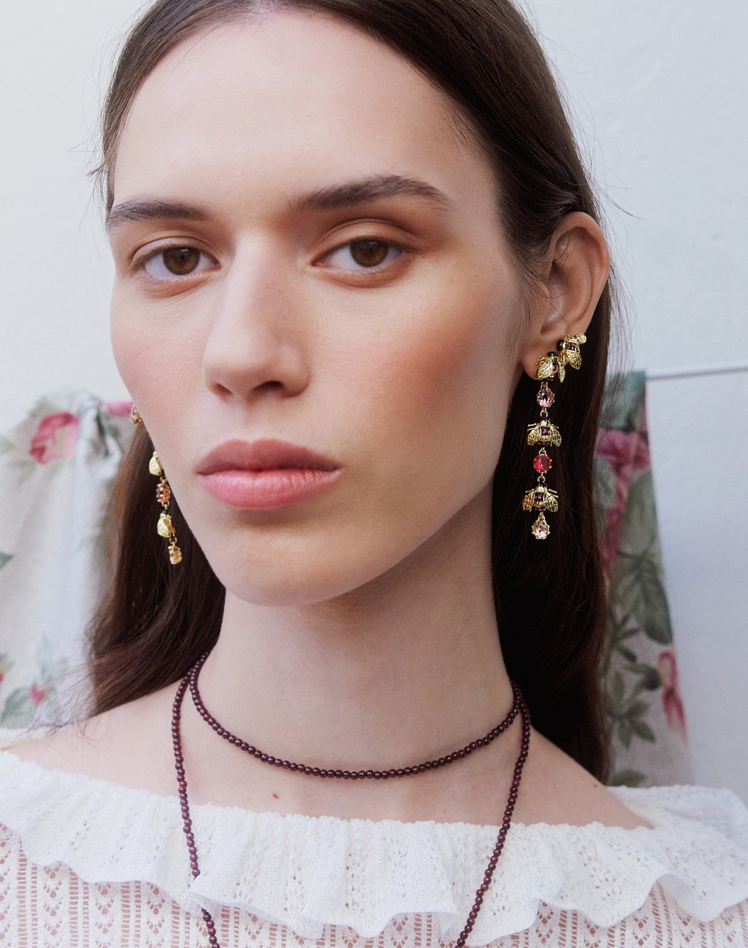 Gold bee and pink stone earrings