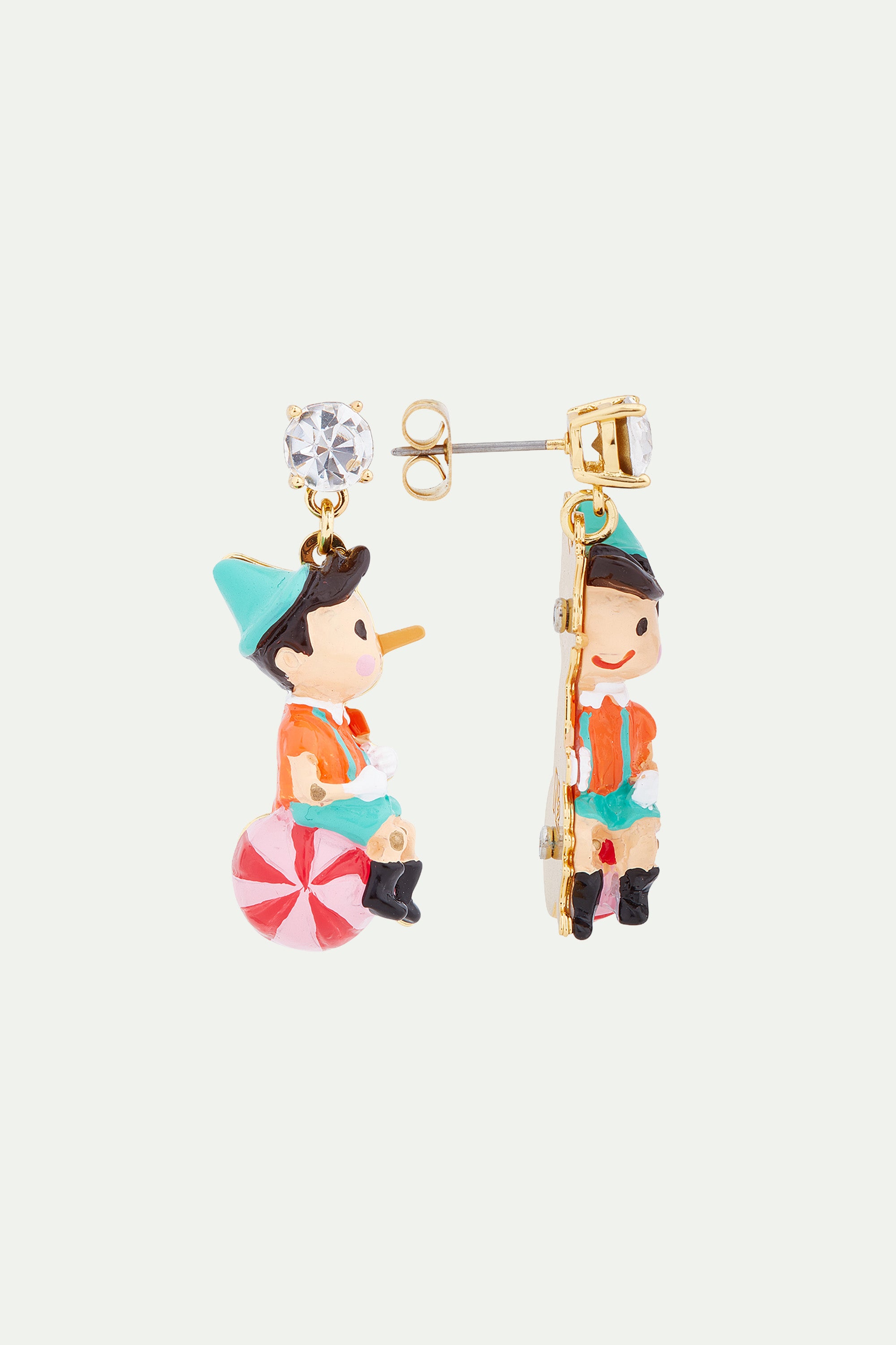 Pinocchio on his ball clip-on earrings