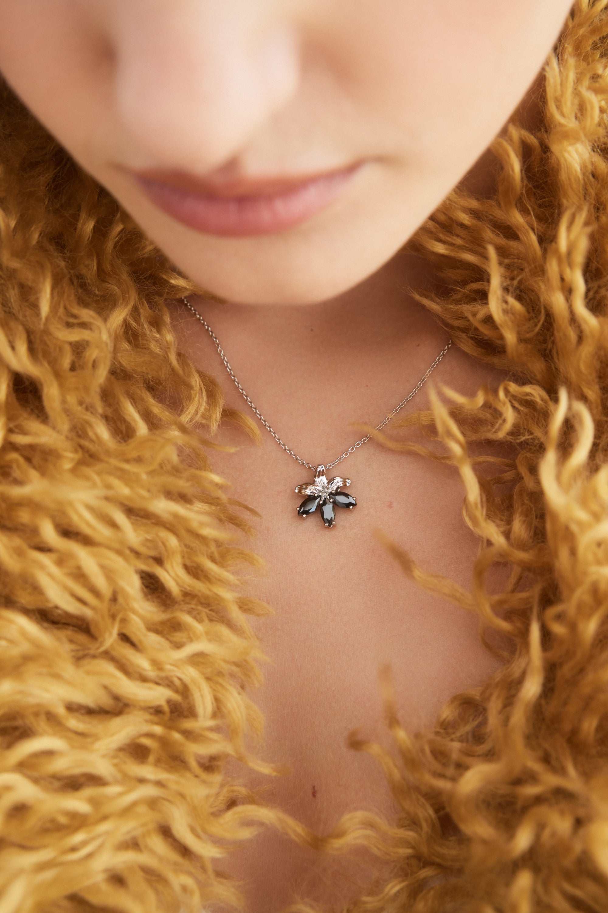 Silver lily and black stone pendant necklace