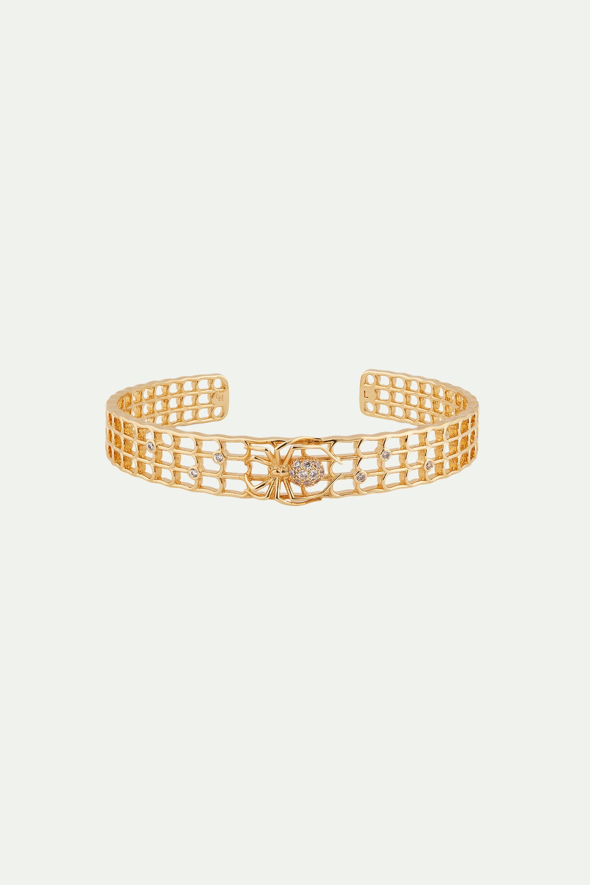 Pulsera rígida dorada calada con esmalte, araña y cristales