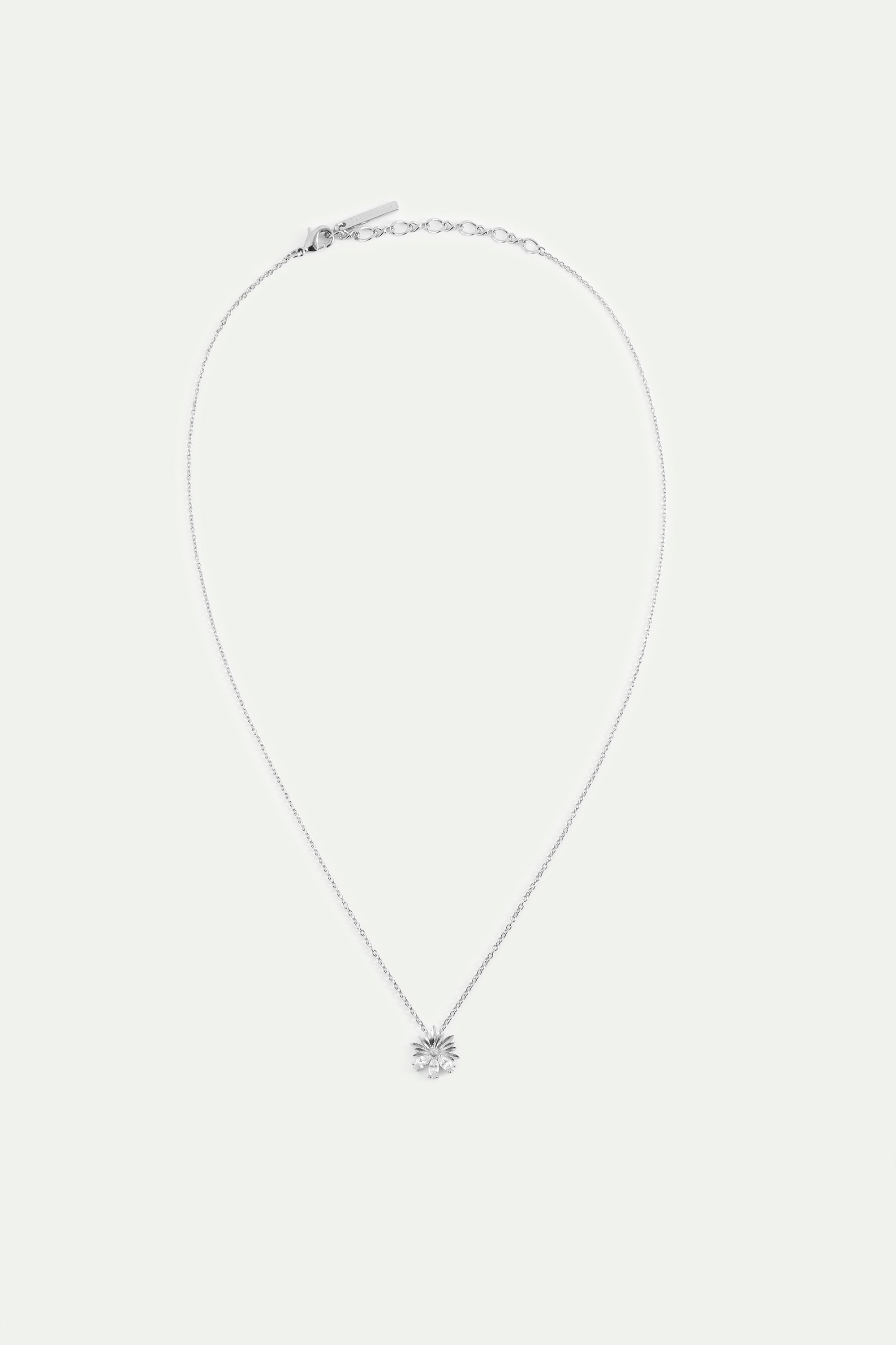 Collier pendentif argenté marguerite et pierres blanches