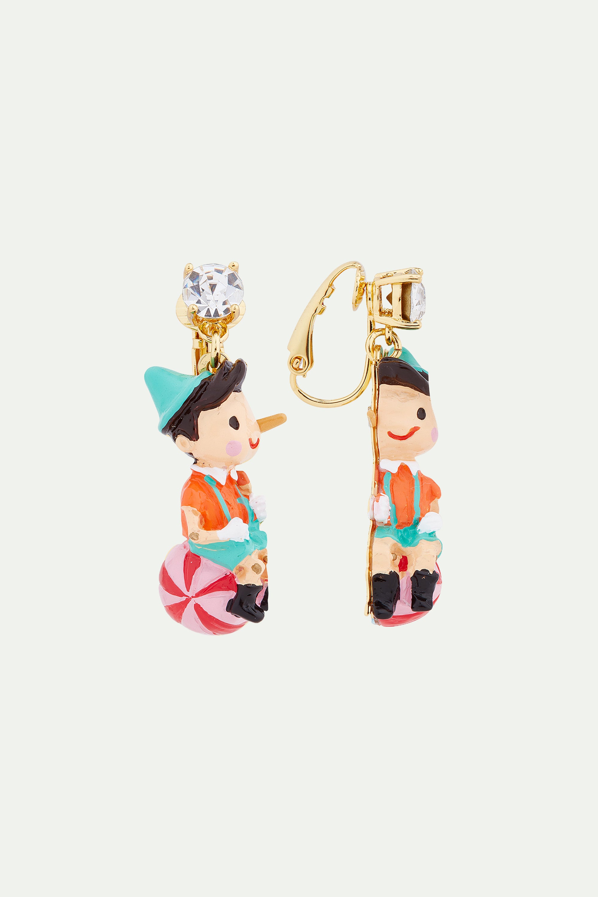 Pinocchio on his ball clip-on earrings