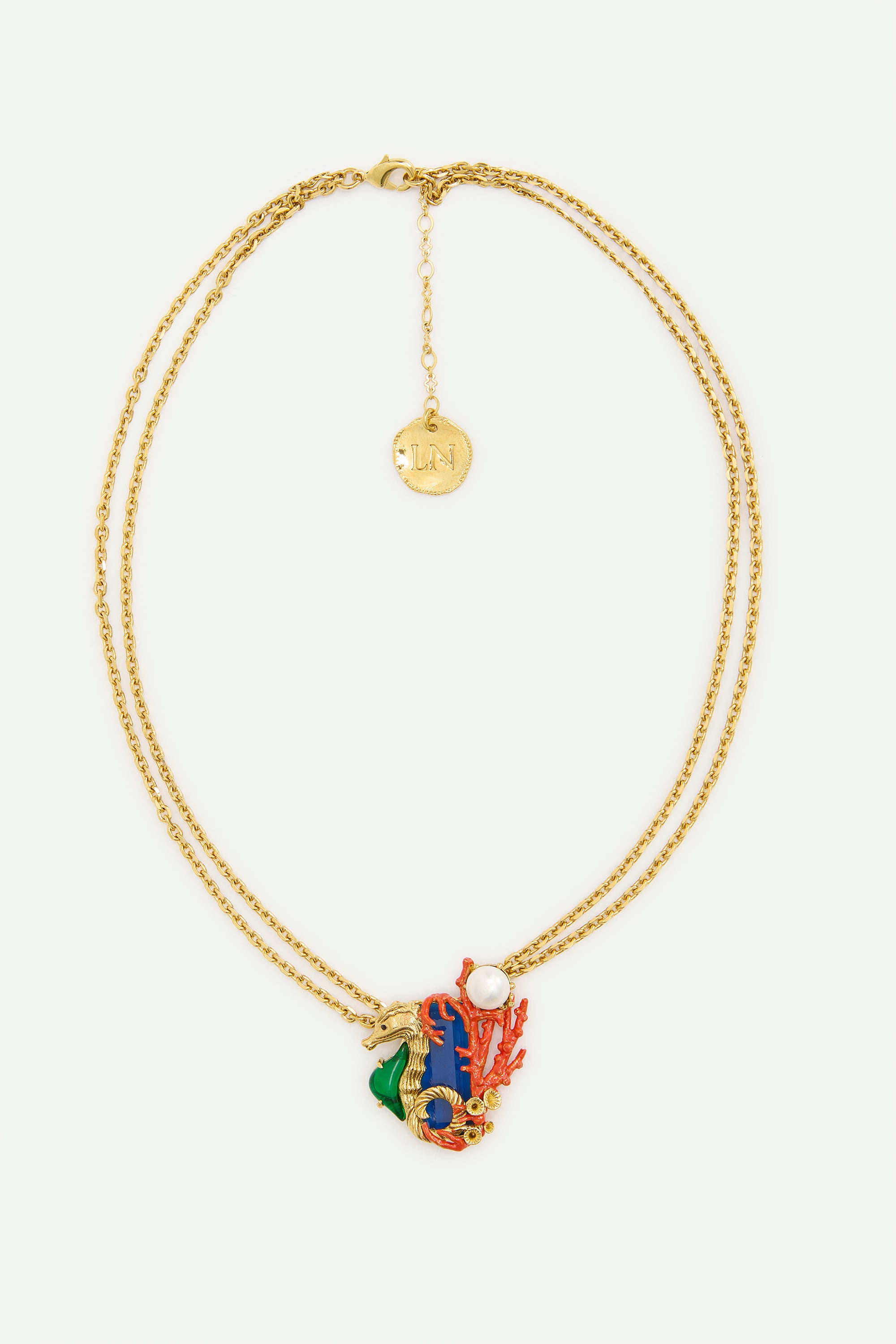 Collier pierre bleu marine et hippocampe vert et doré